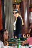 Lindsay Lohan leggy in denim shorts and busty in white top at Bar Pitti in Manhattan