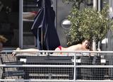 Liv Tyler sunbathing topless on the balcony of her hotel in Copenhagen in Denmark